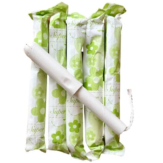A group of individually wrapped, white tampons with a green floral pattern, next to a single tampon partially removed from its wrapper.